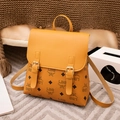 Classic yellow monogram mini backpack with gold buckles and synthetic lychee leather texture - Brown