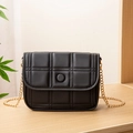 Classic black quilted messenger bag featuring gold chain strap and elegant square texture - Black
