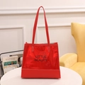 Glossy red patent leather tote bag with Little Beauty slogan and white stitching - Red