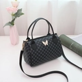 Black Boston bag with circular print, butterfly charm and detachable strap - Black