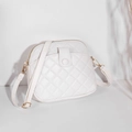 White quilted faux leather round shoulder bag with elegant golden zipper and front pocket - White