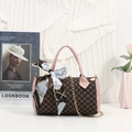 Brown monogram cylinder handbag with pink leather trim and decorative silk scarf strap - Pink
