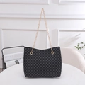 Borsa a secchiello nera da donna con motivo circolare e tracolla a catena d'oro - Nero