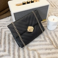 Elegant black quilted chain bag with V-pattern stitching and golden hexagonal lock - Black