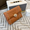 Chic brown quilted chain shoulder bag with a gold hexagonal twist lock and V-stitch pattern - Brown