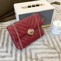 Red V-quilted faux leather crossbody bag with elegant gold chain and metal lock - Red