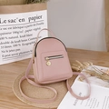 Mini pink leather backpack for women featuring golden zippers and a minimalist design - Pink