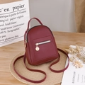 Mini burgundy PU leather backpack for women with golden ring zipper and dual straps - Red