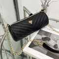 Black V-quilted cylindrical crossbody bag with gold tree charm and metal chain strap - Black