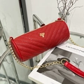 Red quilted round cylinder bag with gold tree charm and metal chain strap - Red
