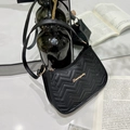 Chic black underarm bag featuring V-quilted faux leather and golden metal logo accent - Wave Black