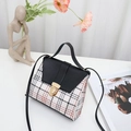 Retro plaid crossbody bag with black leather flap and golden circular metal lock - Black
