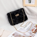 Chic black plush crossbody bag with quilted faux fur, golden chain, and twist lock - Black