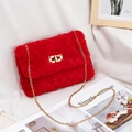 Quilted red faux fur crossbody bag featuring a golden chain strap and swivel lock - Red