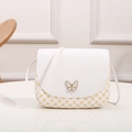 White shell crossbody bag with golden clover print and butterfly metal lock detail - White