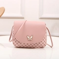 Pink mini crossbody bag with a white butterfly buckle and clover pattern print - Pink