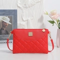 Red quilted crossbody square bag with a golden metal patch and slim shoulder strap - Red