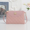 Elegant soft pink quilted crossbody bag with golden metal hardware and long strap - Pink