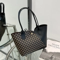 Chic tote bag featuring black leather trim and brown circular pattern print details - Black