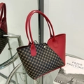 Vintage printed bucket bag with red leather handles and contrast color stitching - Red