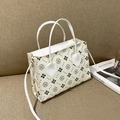 Mini cream handbag with black floral print and adjustable shoulder strap on tan base - White