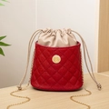 Red quilted stingray pattern bucket bag with gold chain strap and drawstring closure - Red