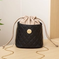 Chic black quilted leather bucket bag with beige drawstring and gold chain strap - Black