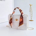 Mini white quilted handbag with orange silk scarf handle and golden chain strap - White