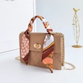 Quilted khaki crossbody bag with gold lock and floral silk scarf wrapped handle - Khaki