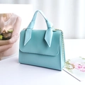 Mini light blue PU leather handbag with twist knot handle and golden chain strap - Blue