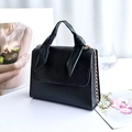 Mini matte black PU leather handbag with gold chain strap and decorative knot detail - Black