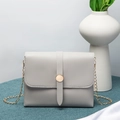 Elegant light gray crossbody bag with gold chain strap and circular metal buckle - Light Gray
