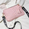 Pink quilted crossbody bag with a trendy LOVE strap and decorative matching tassel - Pink