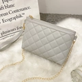 Chic light grey quilted crossbody bag with golden chain strap and refined rhombus patterns - Gray