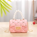 Mini pink jelly crossbody bag with quilted rhinestones, pearl handle, and gold chain strap - Pink