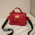 Red patent leather mini bag with gold lock and black/white lettered woven strap - Red