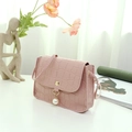 Pink crocodile embossed mini crossbody bag featuring pearl pendant and gold metal buckle - Pink
