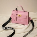 Pink patent leather crossbody bag with wide fabric strap and stylish metal lock buckle - Pink