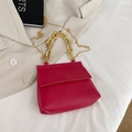 Rose red handbag with lychee texture featuring a chunky gold chain and metal strap - Red