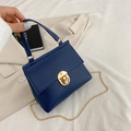 Navy blue crocodile pattern mini handbag with gold chain strap and metal lock - Blue