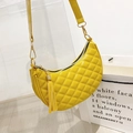 Quilted crescent shoulder bag in bright yellow PU leather with tassel and gold hardware - Yellow