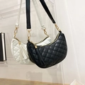 Black and white quilted hobo bags with leather tassels and gold zipper hardware - White