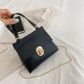 Matte black crocodile texture trapezoid handbag with gold rotating lock and chain - Black