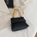Fashionable black pebbled leather handbag with chunky gold chain handle and strap - Black