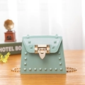 Mini mint green studded jelly bag with glossy PVC finish and metallic chain strap - Green
