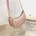 Pink crescent shoulder bag with quilted diamond pattern and fringe tassel detail - Pink