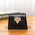 Glossy black jelly bag with gold stud rivets and chain strap in a square crossbody style - Black