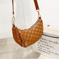 Brown hobo shoulder bag with quilted pattern, tassel detail, and golden hardware - Brown