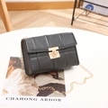 Classic black quilted crossbody bag with golden chain strap and twist lock detail - Black