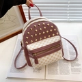 Mini backpack in beige monogram and dark red leather with golden pyramid studs - Dusty Pink